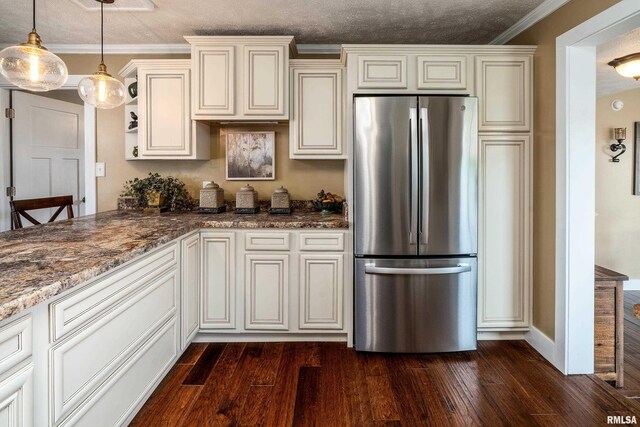 213 Texas Ave, Carterville, IL 62918 - kitchen with freestanding refrigerator, dark wood-style flooring, cream cabinets, stone countertops, and ornamental molding
