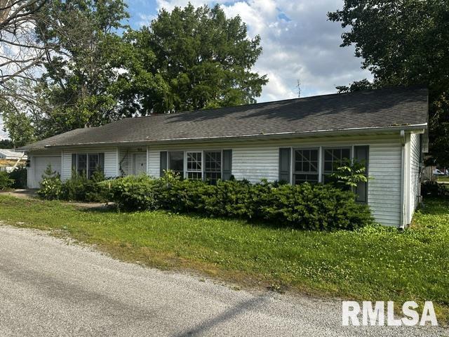 210 N State St, Christopher, IL 62822 - view of front of property with a garage and a front lawn