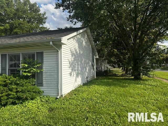 210 N State St, Christopher, IL 62822 - view of side of home featuring a yard