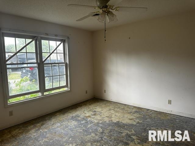 210 N State St, Christopher, IL 62822 - empty room featuring ceiling fan