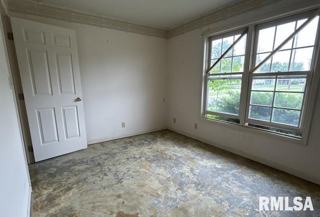 210 N State St, Christopher, IL 62822 - spare room featuring healthy amount of natural light and baseboards