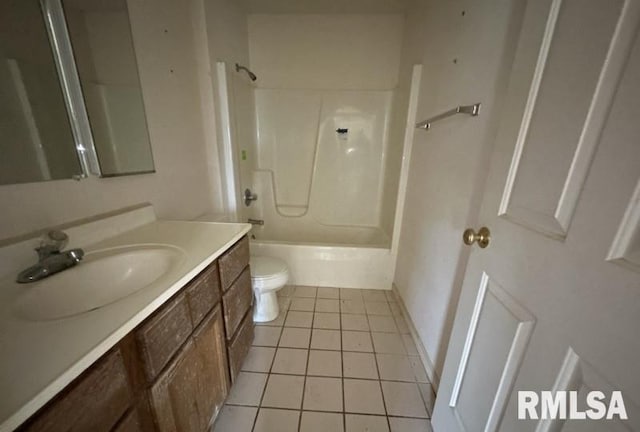 210 N State St, Christopher, IL 62822 - full bathroom featuring vanity, toilet, shower / bathtub combination, and tile patterned floors