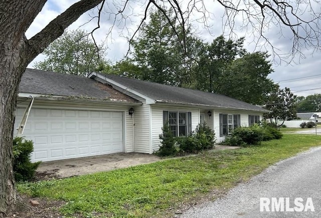 210 N State St, Christopher, IL 62822 - ranch-style home with an attached garage and a front lawn