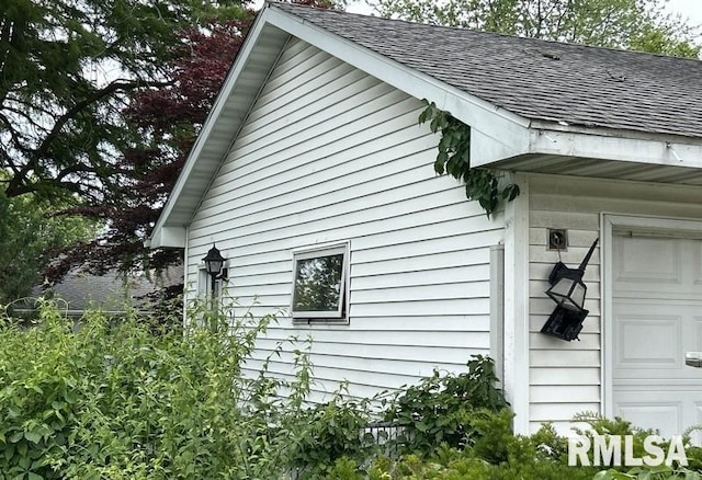 210 N State St, Christopher, IL 62822 - view of side of home with a shingled roof