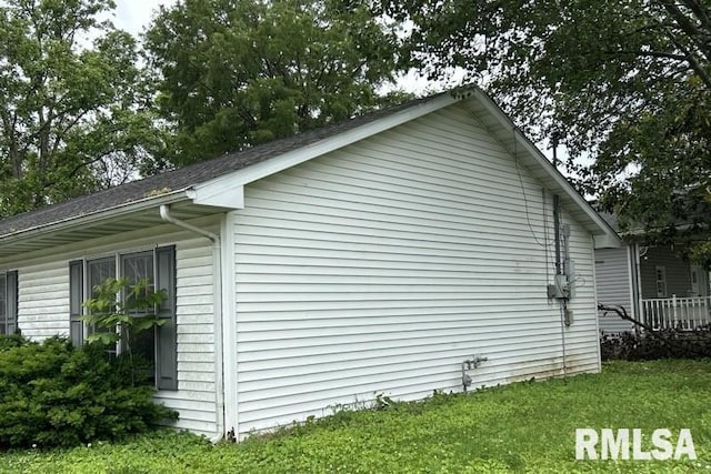 210 N State St, Christopher, IL 62822 - view of side of home featuring a yard