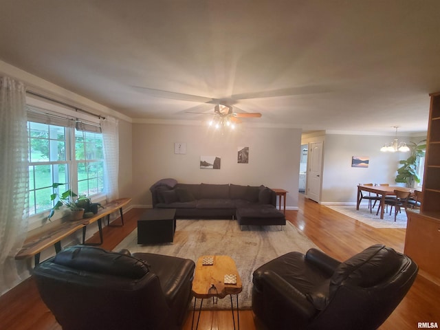 614 S Skyline Dr, Carbondale, IL 62901 - living room with light wood finished floors, crown molding, ceiling fan, baseboards, and a chandelier
