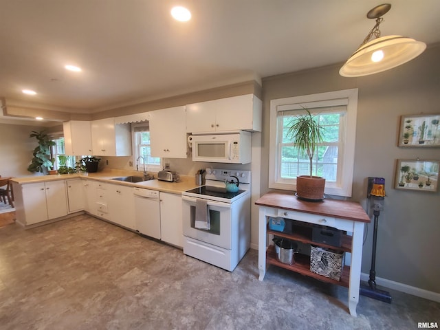 614 S Skyline Dr, Carbondale, IL 62901 - kitchen featuring white appliances, a sink, light countertops, and white cabinetry