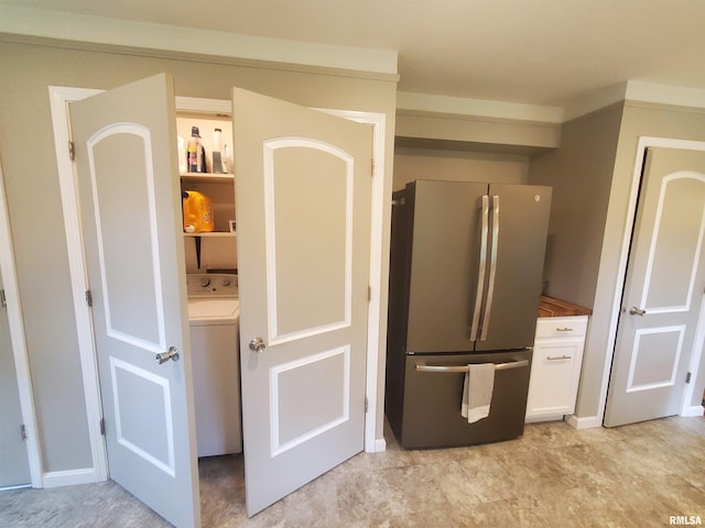 614 S Skyline Dr, Carbondale, IL 62901 - kitchen featuring freestanding refrigerator, washer / dryer, and white cabinets