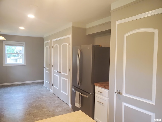 614 S Skyline Dr, Carbondale, IL 62901 - kitchen featuring freestanding refrigerator, white cabinetry, recessed lighting, baseboards, and dark countertops