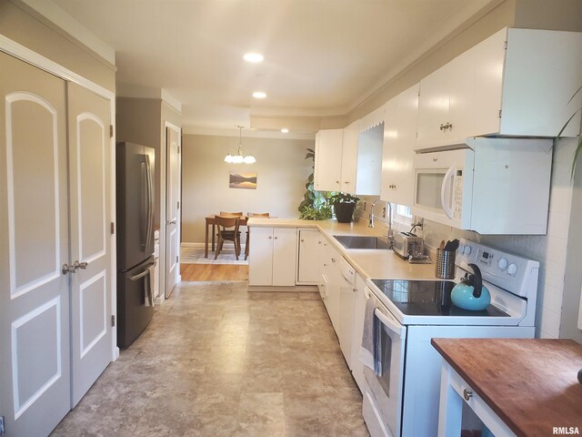 614 S Skyline Dr, Carbondale, IL 62901 - kitchen featuring white appliances, a sink, wooden counters, a chandelier, and white cabinets