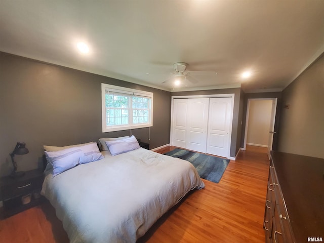 614 S Skyline Dr, Carbondale, IL 62901 - bedroom featuring a closet, light wood finished floors, a ceiling fan, crown molding, and baseboards
