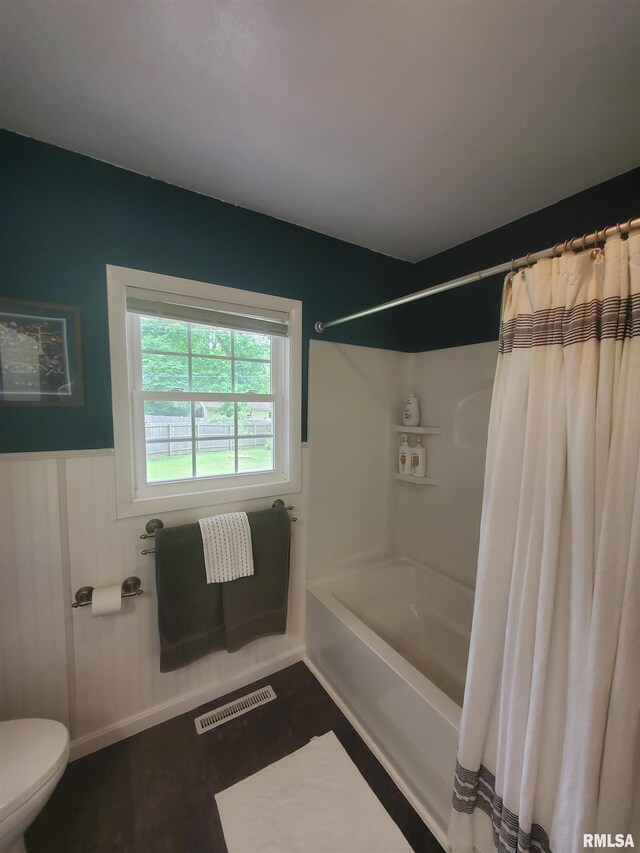 614 S Skyline Dr, Carbondale, IL 62901 - full bathroom featuring toilet, a wainscoted wall, and shower / bath combination with curtain