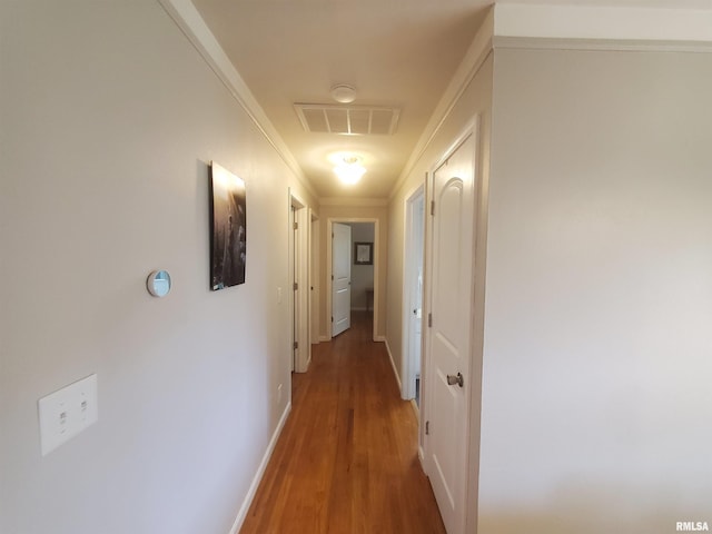 614 S Skyline Dr, Carbondale, IL 62901 - hall featuring wood finished floors, ornamental molding, baseboards, and attic access