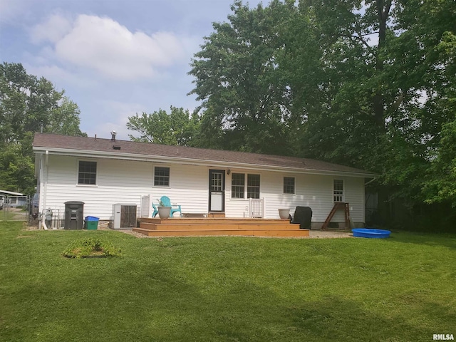 614 S Skyline Dr, Carbondale, IL 62901 - rear view of house featuring central air condition unit, a yard, and a wooden deck