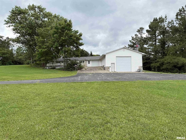 15 Dunn Ln, Goreville, IL 62939 - ranch-style house featuring a front yard, driveway, and a garage
