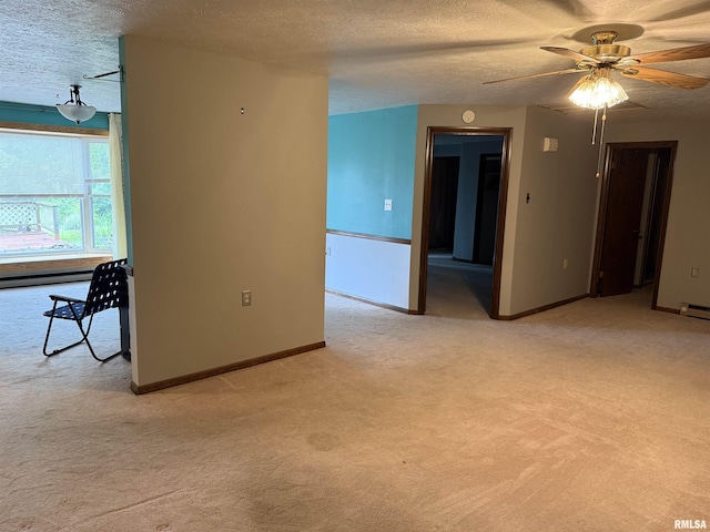 15 Dunn Ln, Goreville, IL 62939 - empty room with light colored carpet, a textured ceiling, a ceiling fan, and baseboards