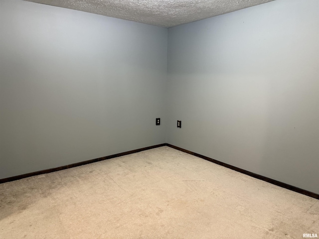 15 Dunn Ln, Goreville, IL 62939 - unfurnished room featuring carpet flooring, a textured ceiling, and baseboards