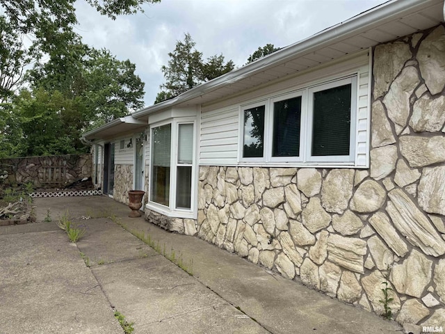 15 Dunn Ln, Goreville, IL 62939 - view of property exterior featuring stone siding and a patio area