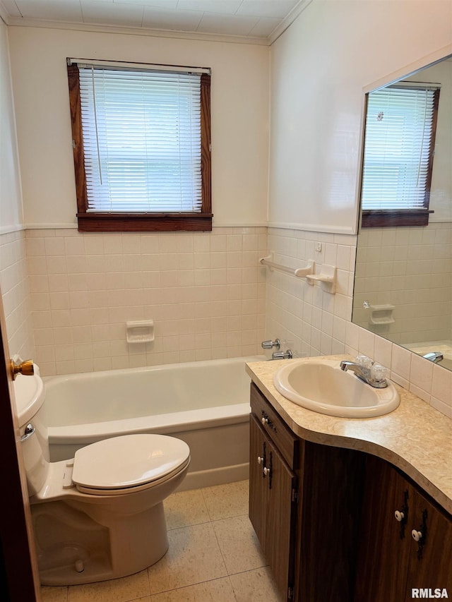 101 Nile St, Anna, IL 62906 - bathroom featuring toilet, healthy amount of natural light, vanity, a bathtub, and tile walls