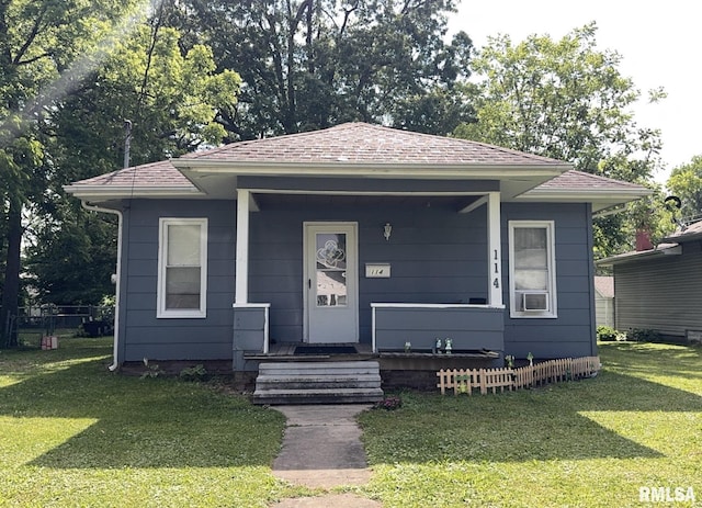 114 S 9th St, Benton, IL 62812 - bungalow-style house with a front yard, a shingled roof, and covered porch