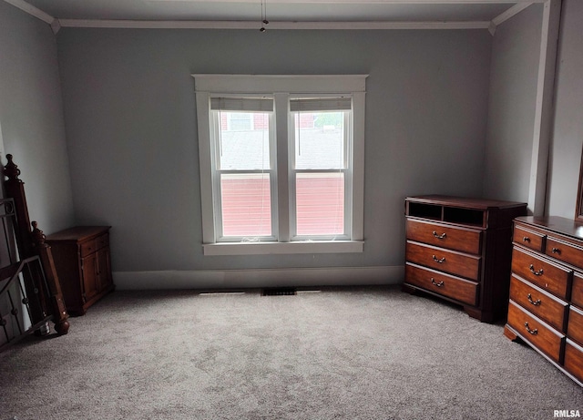 704 S Washington St, Mcleansboro, IL 62859 - unfurnished bedroom with light carpet and crown molding