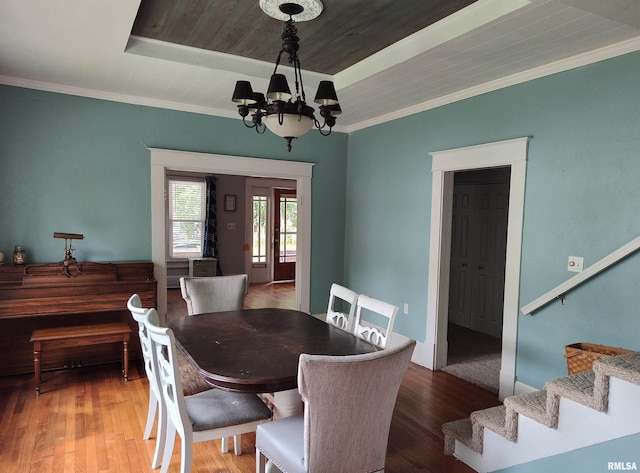 704 S Washington St, Mcleansboro, IL 62859 - dining area with a chandelier, stairs, wood finished floors, ornamental molding, and wood ceiling