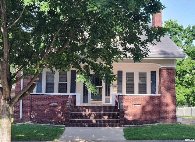 704 S Washington St, Mcleansboro, IL 62859 - view of front of property with brick siding and a chimney