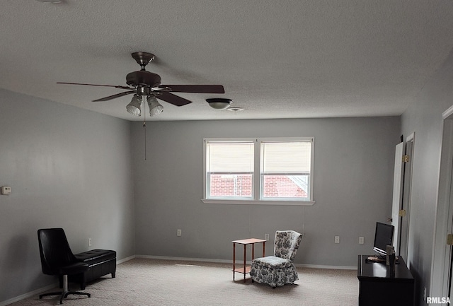 704 S Washington St, Mcleansboro, IL 62859 - living area with carpet, a ceiling fan, a textured ceiling, and baseboards