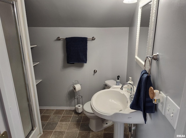 704 S Washington St, Mcleansboro, IL 62859 - bathroom with toilet and baseboards