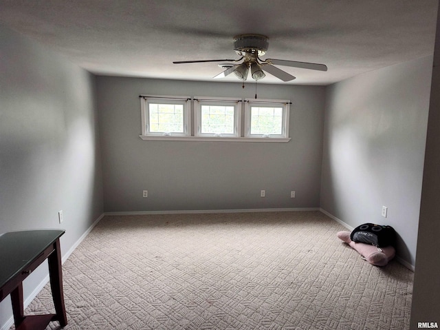 704 S Washington St, Mcleansboro, IL 62859 - spare room featuring a ceiling fan, carpet, and baseboards