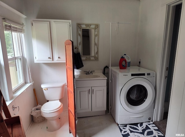 704 S Washington St, Mcleansboro, IL 62859 - bathroom with washer / dryer, vanity, and toilet