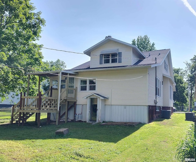 704 S Washington St, Mcleansboro, IL 62859 - rear view of house with a yard, a deck, central air condition unit, and stairway