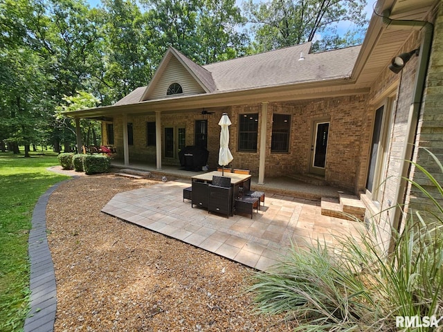 9 Fawn Dr, Fairfield, IL 62837 - rear view of property with a patio area, brick siding, a shingled roof, and a lawn