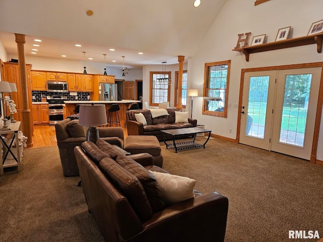 9 Fawn Dr, Fairfield, IL 62837 - living room with recessed lighting, light carpet, decorative columns, high vaulted ceiling, and baseboards