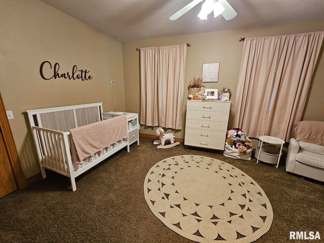 9 Fawn Dr, Fairfield, IL 62837 - bedroom featuring dark carpet, a crib, and a ceiling fan