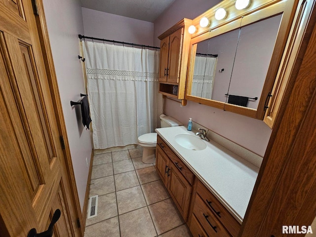 9 Fawn Dr, Fairfield, IL 62837 - bathroom featuring vanity, toilet, tile patterned flooring, and a shower with curtain