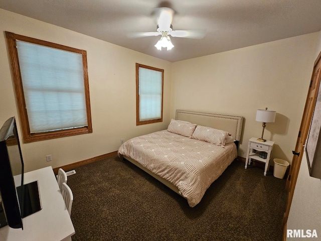 9 Fawn Dr, Fairfield, IL 62837 - bedroom featuring dark carpet, baseboards, and a ceiling fan