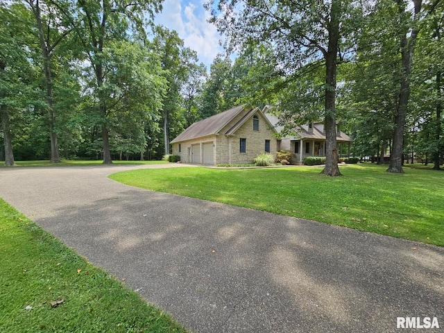 9 Fawn Dr, Fairfield, IL 62837 - view of front of property with a garage, a front lawn, driveway, and view of scattered trees
