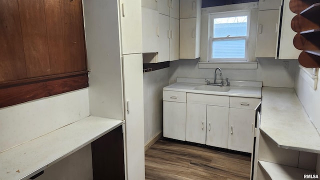 608 N Otis St, Marion, IL 62959 - kitchen featuring a sink, light countertops, and white cabinets