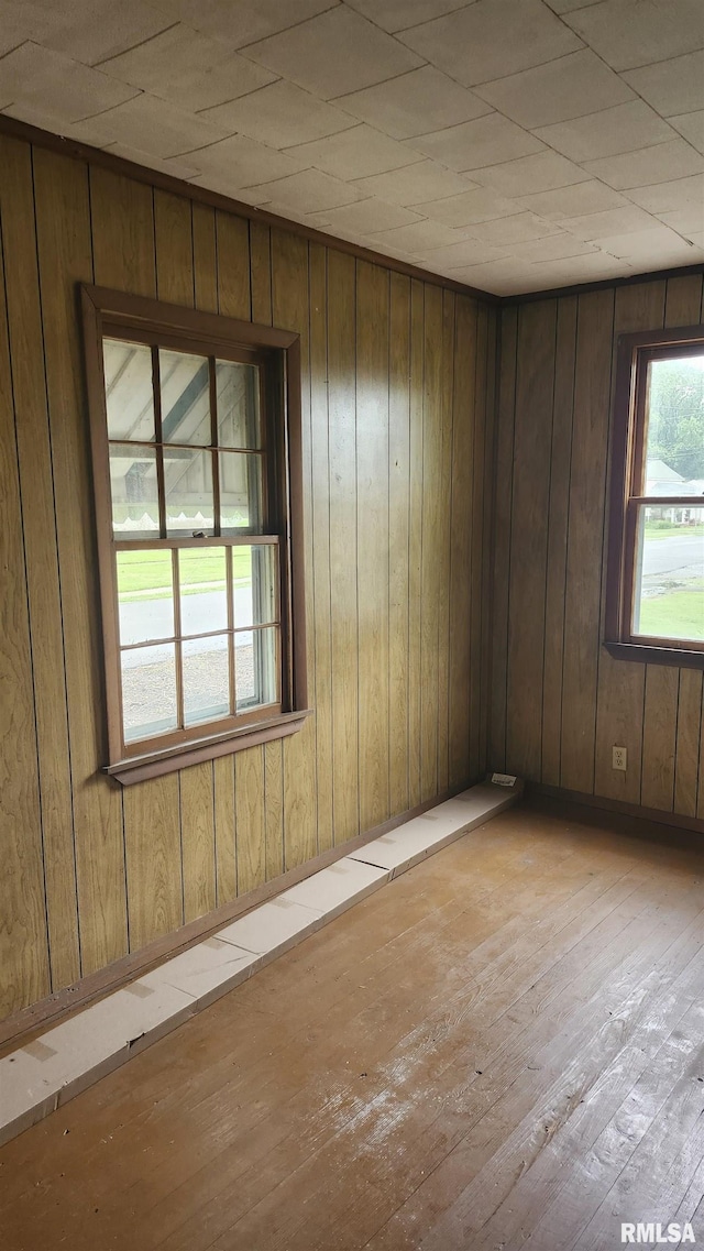 608 N Otis St, Marion, IL 62959 - empty room featuring wood-type flooring and wooden walls