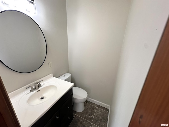 1318 E 4th St, Centralia, IL 62801 - half bathroom featuring toilet, vanity, and tile patterned flooring