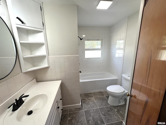 1318 E 4th St, Centralia, IL 62801 - full bath featuring toilet, tile walls, vanity, and shower / tub combination