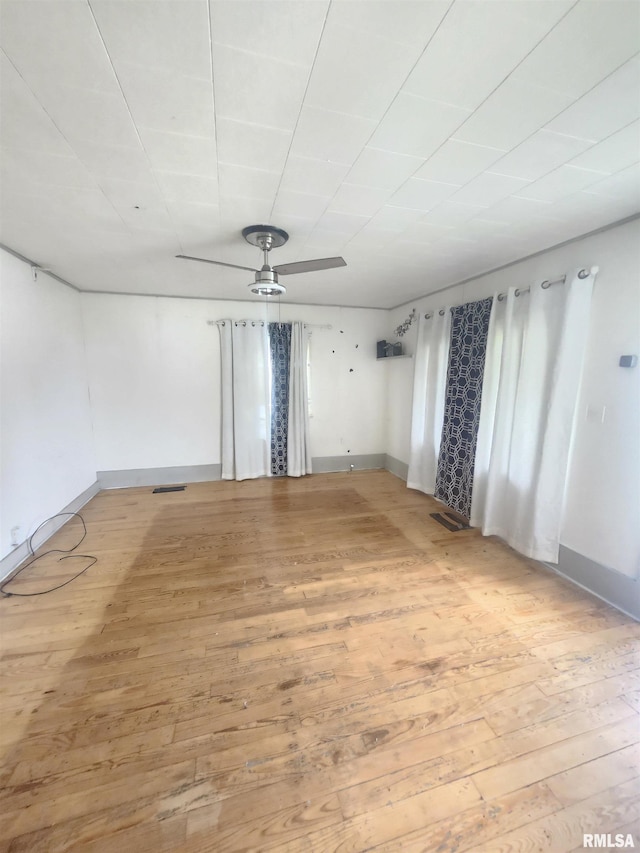 528 N 15th St, Murphysboro, IL 62966 - spare room featuring ceiling fan, light wood-type flooring, and baseboards