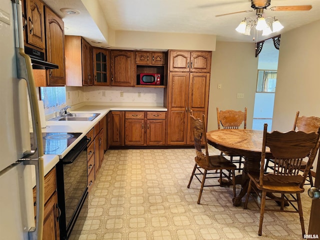 3685 Lick Creek Rd, Anna, IL 62906 - kitchen featuring black / electric stove, freestanding refrigerator, light flooring, ceiling fan, and light countertops