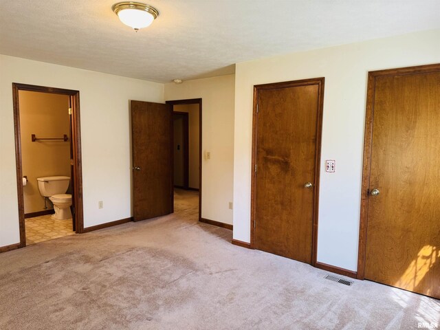 3685 Lick Creek Rd, Anna, IL 62906 - unfurnished bedroom with carpet floors, baseboards, and ensuite bathroom