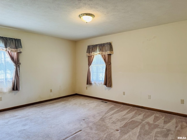 3685 Lick Creek Rd, Anna, IL 62906 - unfurnished room with carpet floors, baseboards, and a textured ceiling