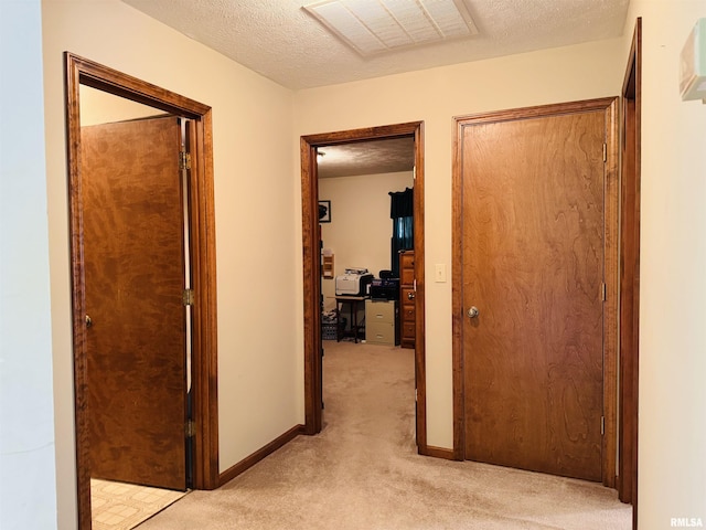 3685 Lick Creek Rd, Anna, IL 62906 - hall with light colored carpet, an office area, a textured ceiling, and baseboards