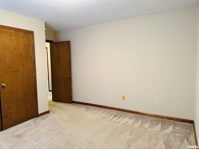 3685 Lick Creek Rd, Anna, IL 62906 - spare room featuring light carpet and baseboards