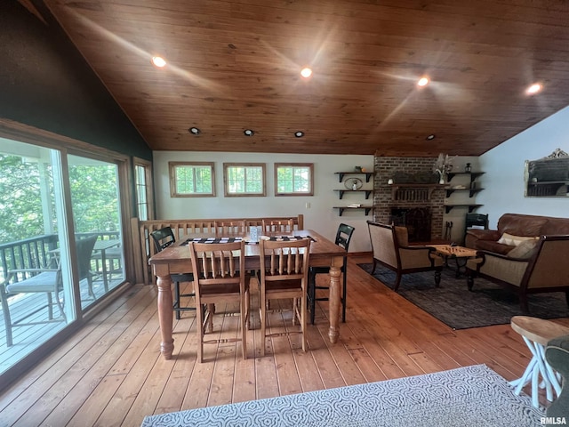 1150 Lakeview Dr, Creal Springs, IL 62922 - dining space featuring vaulted ceiling, hardwood / wood-style flooring, a brick fireplace, wooden ceiling, and recessed lighting