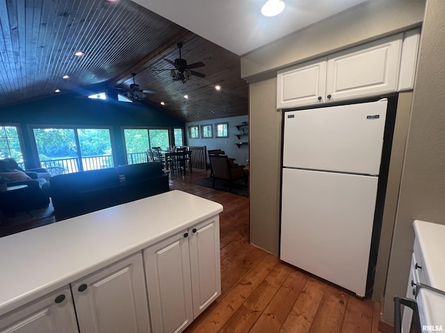 1150 Lakeview Dr, Creal Springs, IL 62922 - kitchen with freestanding refrigerator, light wood-style floors, ceiling fan, white cabinetry, and lofted ceiling